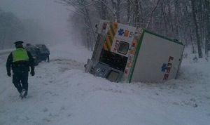 Ambulance from Mason Co flips in Muskegon