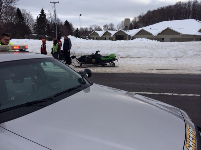 Snowmobiler struck on highway