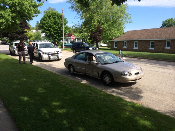 Teen driver runs stops sign, hit by police cruiser