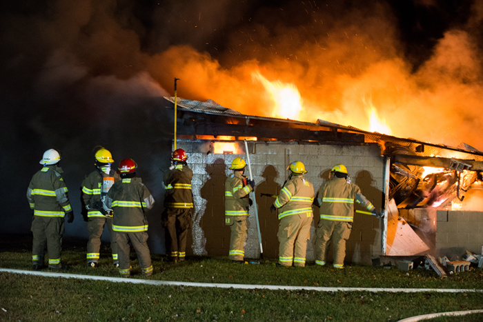 Barn, vehicles destroyed by fire.