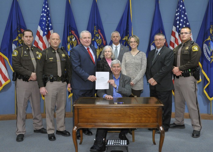 Governor holds signing ceremony dedicating Trooper Butterfield highway.