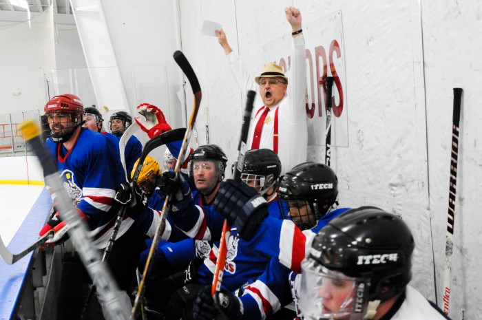 Cops defeat firefighters in hockey match.
