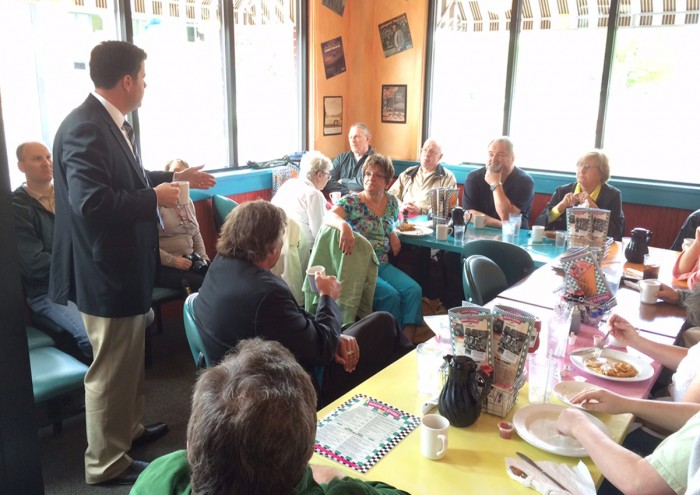 Democrat chairman talks to local group.