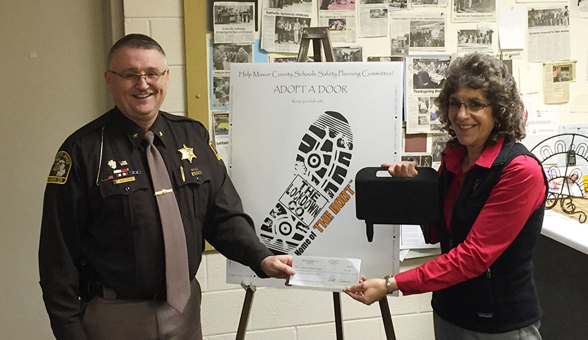 Scottville Optimists donate to school safety campaign; boots installed at MCE, MCE.
