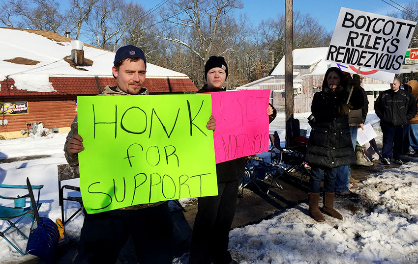 Protesters picket bar, claim man with Down syndrome discriminated against; owner says it’s retaliation.