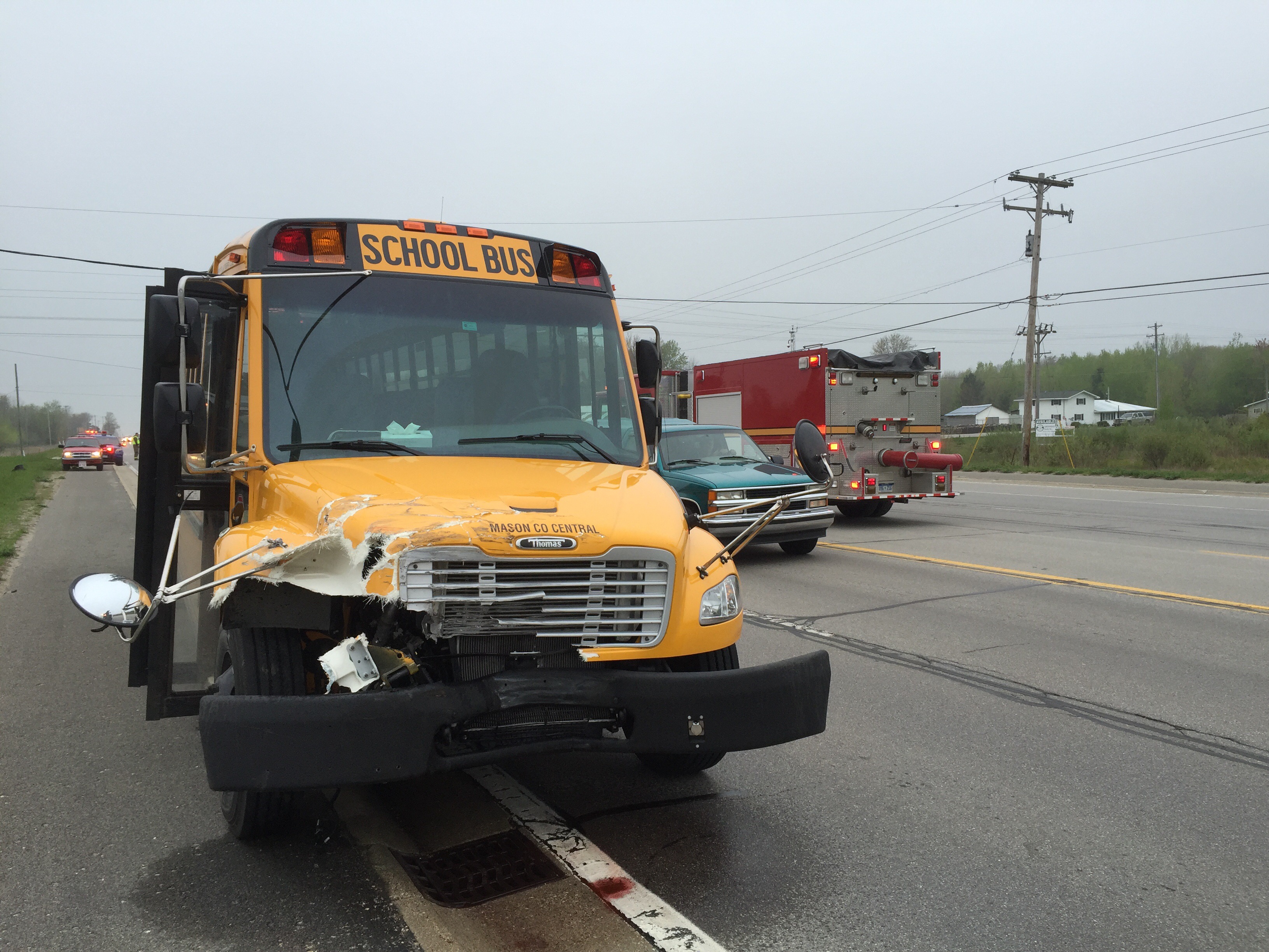 Semi collides with school bus on US 10-31.