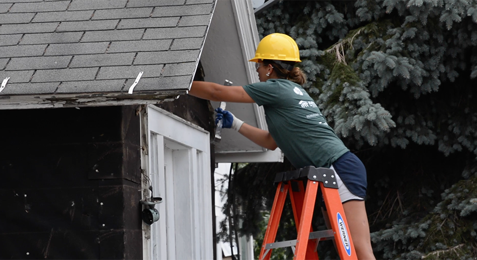 Neighbors helping neighbors. Habitat, Pennies from Heaven partner to clean blighted homes.