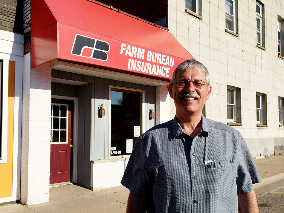 Matt Knizacky buys Scottville Farm Bureau Insurance office.