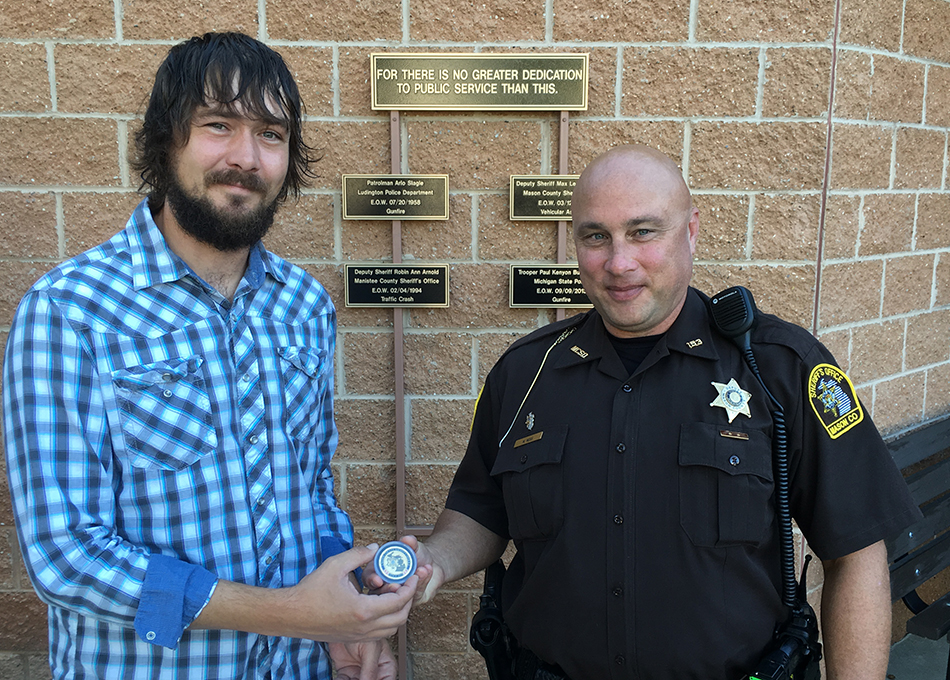 Citizen honored for coming to deputy’s aid.