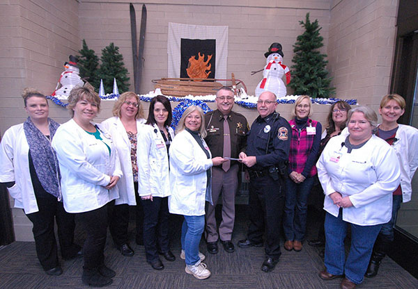 Hospital employees donate to Shop with a Cop.