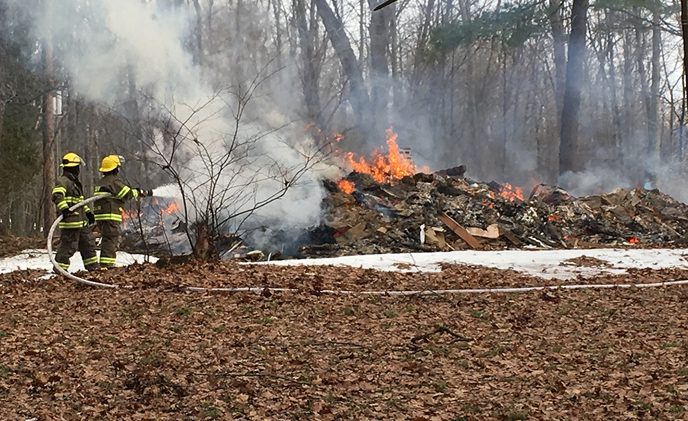 Property owner may face charges after setting house on fire.