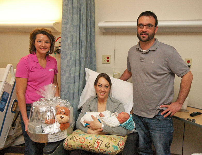 Farm Bureau presents gift basket to Ag Week baby.