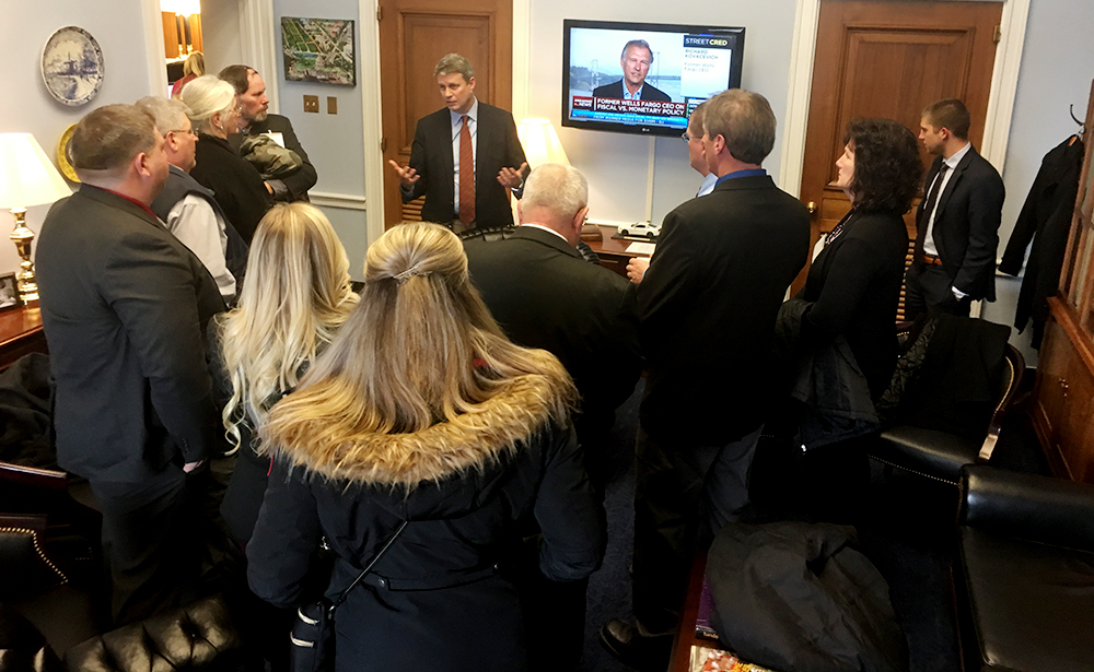 Huizenga speaks with local farmers.
