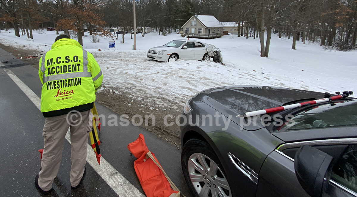 Driver injured after colliding with log truck.